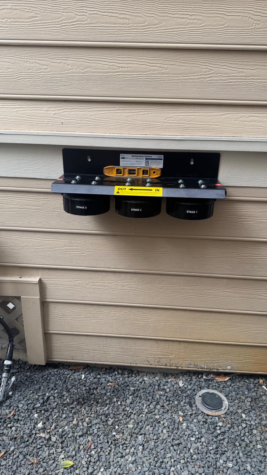 Filter housing mounted on exterior wall